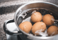 What happens if you leave eggs in hot water too long?